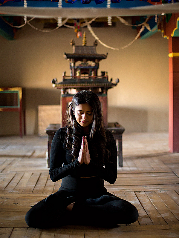 Yoga teacher in prayer